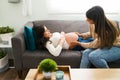 Midwife examining an expectant mother during a check-up at home Royalty Free Stock Photo