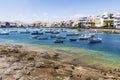 Beautiful downtown of Arrecife with many boats floating on blue water, Lanzarote, Canary Islands, Spain