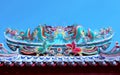 Beautiful dragon statue decorated on chinese temple roof against Royalty Free Stock Photo