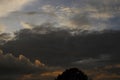 Beautiful dramatic evening sky with dark grey clouds and orange highlight in the afternoon Royalty Free Stock Photo