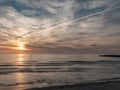 Beautiful dramatic golden sky over the sea, reflection at sunset time, long exposure Royalty Free Stock Photo