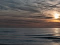 Beautiful dramatic golden sky over the sea, reflection at sunset time, long exposure Royalty Free Stock Photo