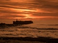 Beautiful dramatic golden sky over the sea, reflection at sunset time, long exposure Royalty Free Stock Photo