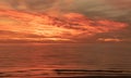 Beautiful dramatic golden sky over the sea, reflection at sunset time, long exposure Royalty Free Stock Photo