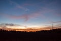 Dramatic orange and blue cloud and sky after storm and raining over agricultural field Royalty Free Stock Photo