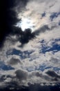 Beautiful dramatic sky with sun rays. Dark clouds and breaking through the sun`s rays Royalty Free Stock Photo