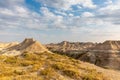 A beautiful and dramatic sky touches an alien landscape in Badlands National Park. Royalty Free Stock Photo