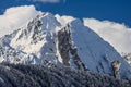 Beautiful dramatic snowy Caucasus mountain peaks and blue sky with clouds scenic winter landscape. West Caucasus. Sochi, Russia Royalty Free Stock Photo