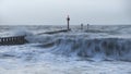 Beautiful dramatic stormy landscape image of waves crashing onto Royalty Free Stock Photo