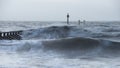 Beautiful dramatic stormy landscape image of waves crashing onto Royalty Free Stock Photo