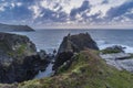 Beautiful dramatic Summer dawn over Lizard Point in Cornwall UK with lovely glowing sky and clouds