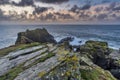 Beautiful dramatic Summer dawn over Lizard Point in Cornwall UK with lovely glowing sky and clouds