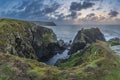 Beautiful dramatic Summer dawn over Lizard Point in Cornwall UK with lovely glowing sky and clouds