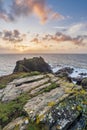 Beautiful dramatic Summer dawn over Lizard Point in Cornwall UK with lovely glowing sky and clouds Royalty Free Stock Photo