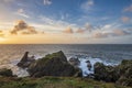 Beautiful dramatic Summer dawn over Lizard Point in Cornwall UK with lovely glowing sky and clouds Royalty Free Stock Photo
