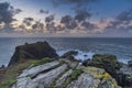 Beautiful dramatic Summer dawn over Lizard Point in Cornwall UK with lovely glowing sky and clouds Royalty Free Stock Photo