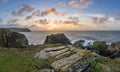 Beautiful dramatic Summer dawn over Lizard Point in Cornwall UK with lovely glowing sky and clouds Royalty Free Stock Photo