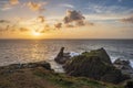 Beautiful dramatic Summer dawn over Lizard Point in Cornwall UK with lovely glowing sky and clouds Royalty Free Stock Photo
