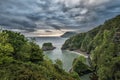 Beautiful dramatic sunrise landsape image of small secluded cove