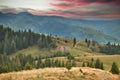 Beautiful dramatic sunset, Carpathian mountains view from Transbucegi, Romania. Royalty Free Stock Photo