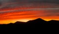 Beautiful and dramatic sunset colours over the volcanic mountain range near Corralejo in Fuerteventura Canary Islands Royalty Free Stock Photo