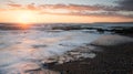 Beautiful dramatic Sunset over a rocky coast Royalty Free Stock Photo