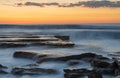 Beautiful dramatic Sunset over a rocky coast Royalty Free Stock Photo