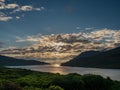 Beautiful, dramatic sunset sky over Killary fjord, county Galway. Sun rays shine through the clouds. Calm and peaceful mood Royalty Free Stock Photo