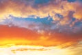 Beautiful dramatic view of a golden fluffy clouds illuminated by