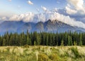 Beautiful dramatic white clouds over mountains. Forest hills in Carpathian mountains. Ukraine