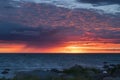 Beautiful drammatic sunset with rocks and beautiful sky. Royalty Free Stock Photo