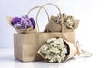 Beautiful dried flower bouquet wrapped with Kraft paper in paper bag