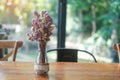 Beautiful Dried statice or Sea Lavender flower Limonium spp. in glass jar on wooden table. for background with blank copy space Royalty Free Stock Photo