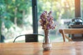 Beautiful Dried statice or Sea Lavender flower Limonium spp. in glass jar on wooden table. for background with blank copy space Royalty Free Stock Photo