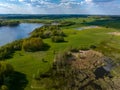 Beautiful drone nature landscape of fields, meadows, forest and lake - sunny day in Poland, Mazury