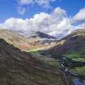 Beautiful drone view over Lake District landscape in late Summer, in Wast Water valley with mountain views and dramatic sky Royalty Free Stock Photo