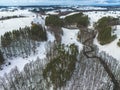 Beautiful drone winter landscape of Poland - snowy fields, lake, river and forest aerial view