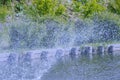 Beautiful drops of water splashing from a fountain on a summer sunny day Royalty Free Stock Photo