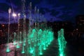 Beautiful dry fountain with bright illuminated jets at night Royalty Free Stock Photo