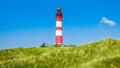 Beautiful dune landscape with traditional lighthouse at North Sea, Germany Royalty Free Stock Photo