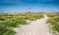 Beautiful dune landscape with traditional lighthouse at North Sea