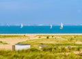 Beautiful dunes of Breskens with boats sailing on the sea, Dutch nature landscape, Zeeland, The Netherlands