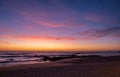 Beautiful dusk over beach in summer with vivid blue orange gradient sky and reflections Royalty Free Stock Photo