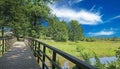 Beautiful dutch rural Aa river valley (Beekdal) landscape, wooden bridge at hiking and cycle trail, North Brabant