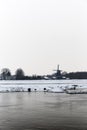 Snow Covered Dutch Windmill River Landscape Duting Golden Hour Royalty Free Stock Photo