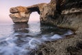A beautiful early morning landscape photograph of the famous Azure Window rock arch