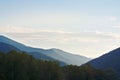 Beautiful early morning sunlight in mountains covered with forests Royalty Free Stock Photo