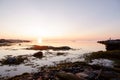 Beautiful early morning sunrise landscape of white sea water dramatic sunrise with first sunlight rays Royalty Free Stock Photo