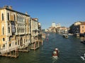 A beautiful early morning view of the Grand Canal in Venice, Italy with water taxis and gondolas past by and the Santa Maria Della Royalty Free Stock Photo