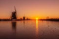 Warm and frozen windmill sunrise